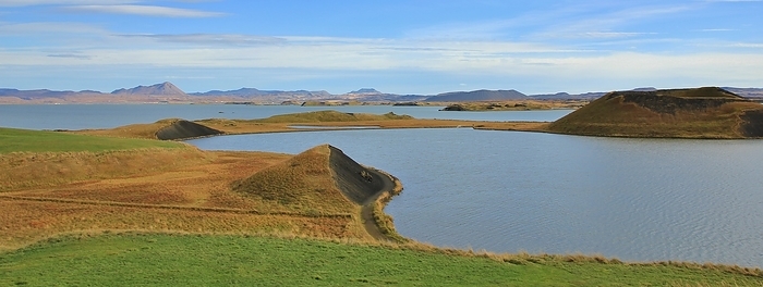 Lake Myvatn on a sunny summer day. Volcanic landscape in Iceland. Lake Myvatn on a sunny summer day. Volcanic landscape in Iceland., by Zoonar Ursula Perret