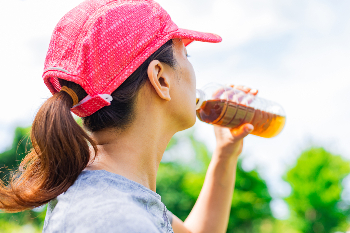 Woman in sports rehydrating