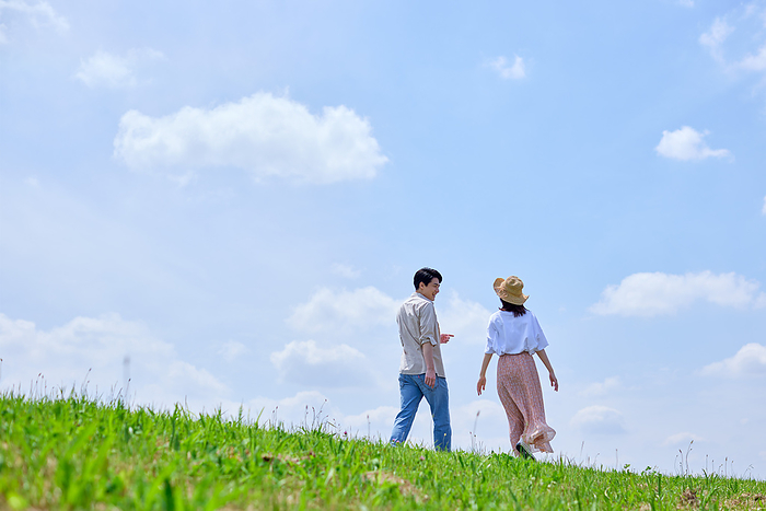 Japanese couple taking a walk with blue sky