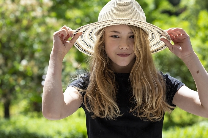 Girl (11) with sun hat, Kiel, Schleswig-Holstein, Germany, Europe, by alimdi / Jana Fernow