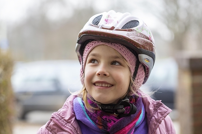 Girl (8) with bicycle helmet, Kiel, Schleswig-Holstein, Germany, Europe, by alimdi / Jana Fernow