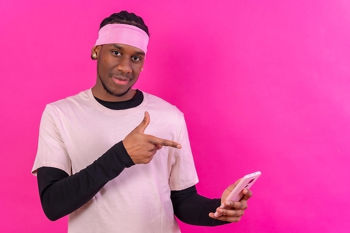Black ethnic man with a phone in pink clothes on a pink background, talking on the phone, by Unai Huizi