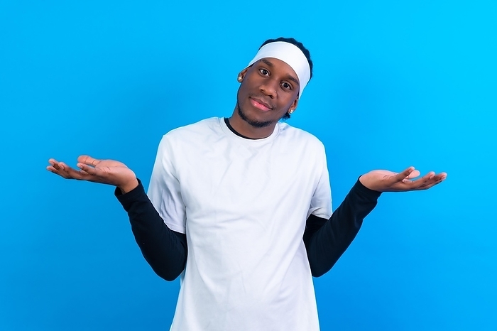 Black ethnic man in white clothes on a blue background, making the thoughtful gesture, by Unai Huizi