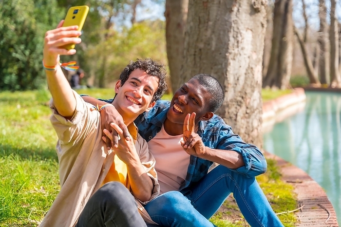 Selfie of a multiethnic gay male couple talking quietly in the park, lgbt concept, by Unai Huizi