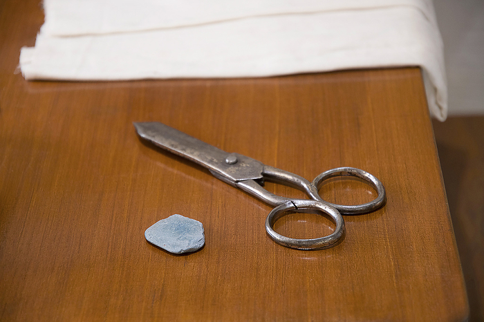 Tailor s instruments. The marker and scissors with cloth in background Tailor s instruments. The marker and scissors with cloth in background, by Zoonar RealityImages