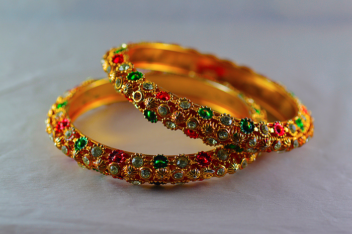 Gold plated colored bangles Gold plated colored bangles, by Zoonar RealityImages