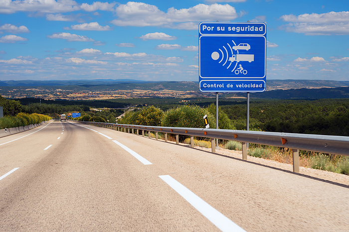 Warning radar sign in spanish highway. Warning radar sign in spanish highway., by Zoonar DAVID HERRAEZ
