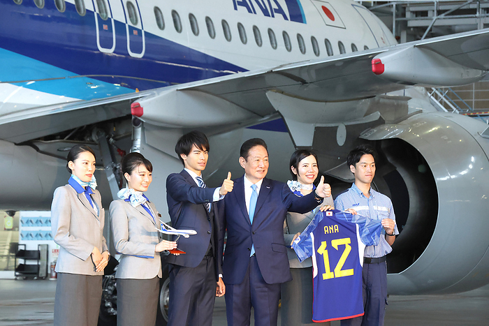 ANA announced an agreement of sponsorship with Japanese football star Kaoru Mitoma June 28, 2023, Tokyo, Japan   Japanese football star Kaoru Mitoma  3rd L  poses for photo with Japan s largest airline All Nippon Airways  ANA  president Shinichi Inoue  3rd R  and ANA employees at the ANA hangar at the Haneda airport in Tokyo on Wednesday, June 28, 2023 as ANA managed a sponsorship agreement with Mitoma on June 1.     photo by Yoshio Tsunoda AFLO 