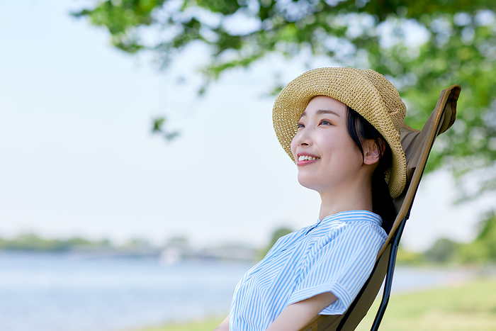 Japanese woman relaxing in a chair