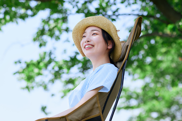 Japanese woman relaxing in a chair