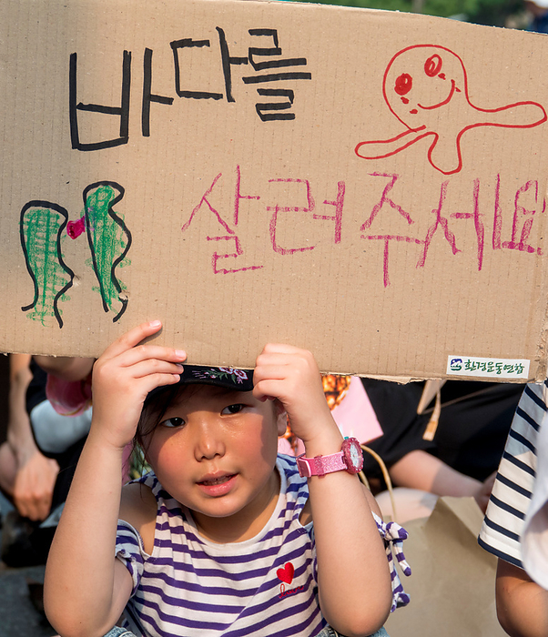 Protest in Seoul against Japan s plan to release radioactive water from the wrecked Fukushima nuclear power plant in to the sea Protest against Japan s plan to release radioactive water, June 24, 2023 : A South Korean child participates in a protest to oppose Japan s decision to discharge radioactive water from the crippled Fukushima nuclear power plant into the sea, in Seoul, South Korera. Protesters condemned South Korean President Yoon Suk Yeol for being a pro Japanese autocrat and called for him to prepare measures to stop Japan s plan to release radioactive water into the ocean. The picket reads, Please save the sea .  Photo by Lee Jae Won AFLO   SOUTH KOREA 