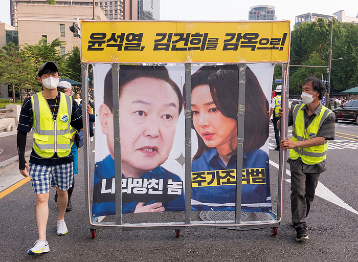 Rally calling for South Korean President Yoon Suk Yeol to prepare measures to stop Japan s decision to discharge radioactive water into the sea Anti Japan and anti Yoon Suk Yeol protest, June 24, 2023 : Protesters carry disgraced portraits of South Korean President Yoon Suk Yeol  L  and first lady Kim Keon Hee during an anti Japan and anti Yoon Suk Yeol protest march in central Seoul, South Korea. Thousands of protesters at the rally condemned South Korean President Yoon for being a pro Japanese autocrat and called for him to prepare measures to stop Japan s decision to discharge radioactive water from the crippled Fukushima nuclear power plant into the Pacific Ocean. Korean characters read,  Yoon Suk Yeol and Kim Keon Hee go to jail    top ,  The guy who ruined this country   bottom L  and  Market manipulator .  Photo by Lee Jae Won AFLO   SOUTH KOREA 