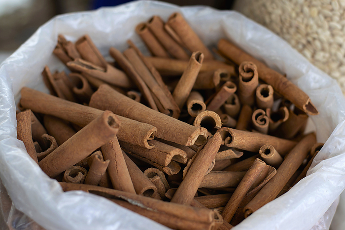 Many sticks of cinnamon for sale in local market, Pune Maharashtra. Many sticks of cinnamon for sale in local market, Pune Maharashtra., by Zoonar RealityImages