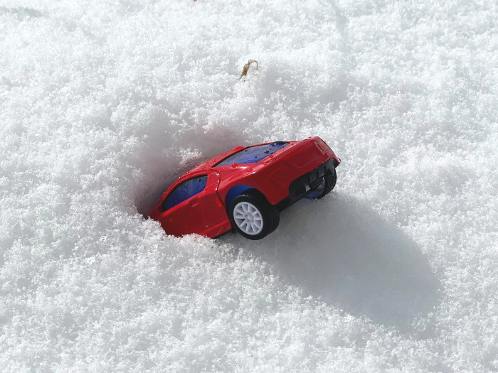 Miniature car plunged into snow