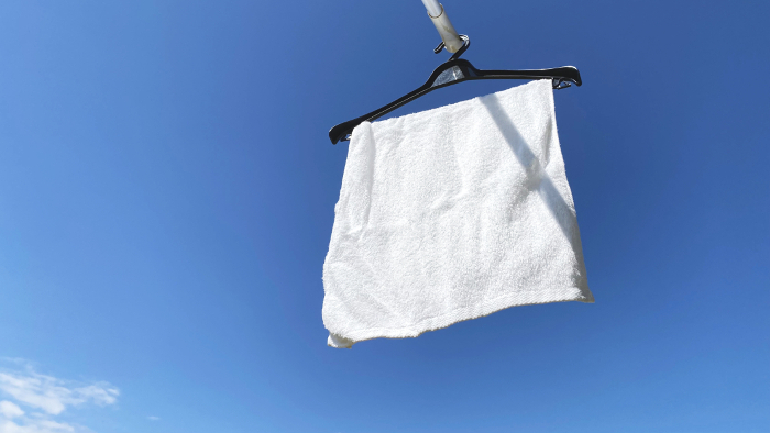 White towels dried in the blue sky