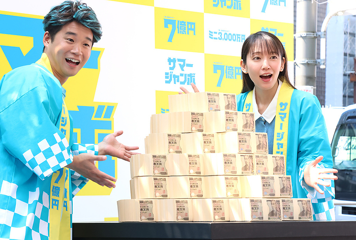 700 million yen Summer Jumbo Lottery goes on sale  July 4, 2023, Tokyo, Japan   Japanese actor Yuma Yamoto  L  and actress Riho Yoshioka  R  display 700 million yen bank notes as they attend a promotional event of the Summer Jumbo Lottery for the first ticket goes on sale in Tokyo on Tuesday, July 4, 2023. Thousands of punters queued up for tickets in the hope of a billionaire.     photo by Yoshio Tsunoda AFLO 