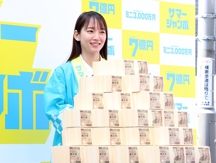 700 million yen Summer Jumbo Lottery goes on sale  July 4, 2023, Tokyo, Japan   Japanese actress Riho Yoshioka displays 700 million yen bank notes as they attend a promotional event of the Summer Jumbo Lottery for the first ticket goes on sale in Tokyo on Tuesday, July 4, 2023. Thousands of punters queued up for tickets in the hope of a billionaire.     photo by Yoshio Tsunoda AFLO 