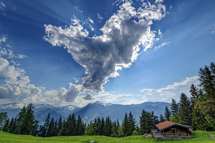 Austria, Tyrol, Clouds over alpine hut at Wiedersberger Horn