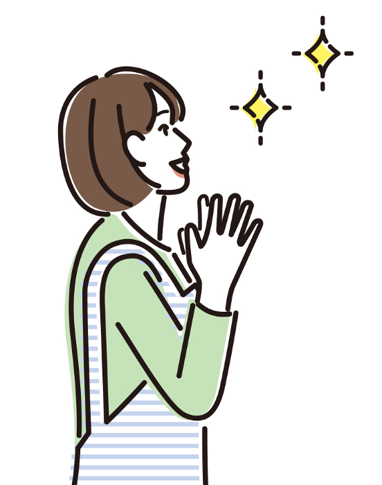 Profile of a woman clapping with delight.