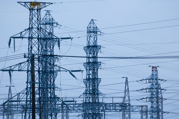 Many high-voltage towers like a mesh