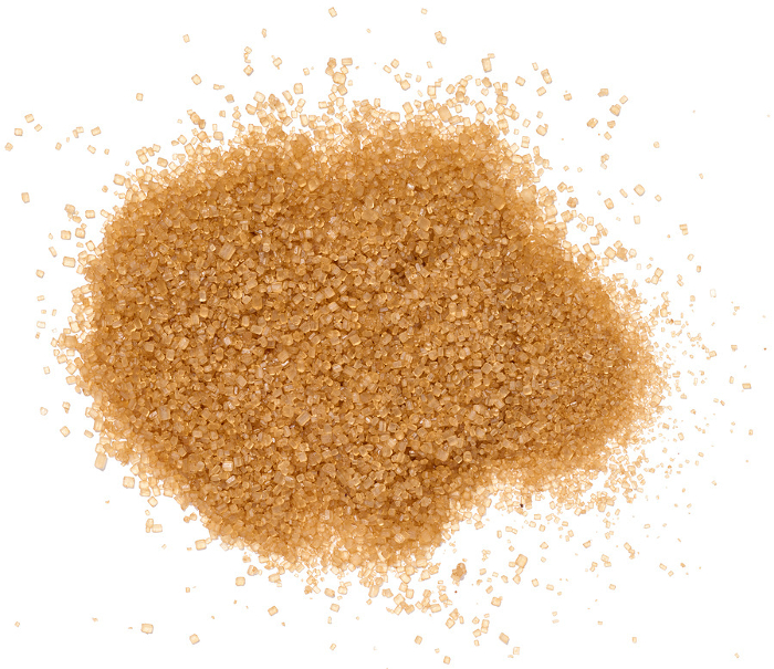 A pile of granulated brown cane sugar, top view A pile of granulated brown cane sugar, top view