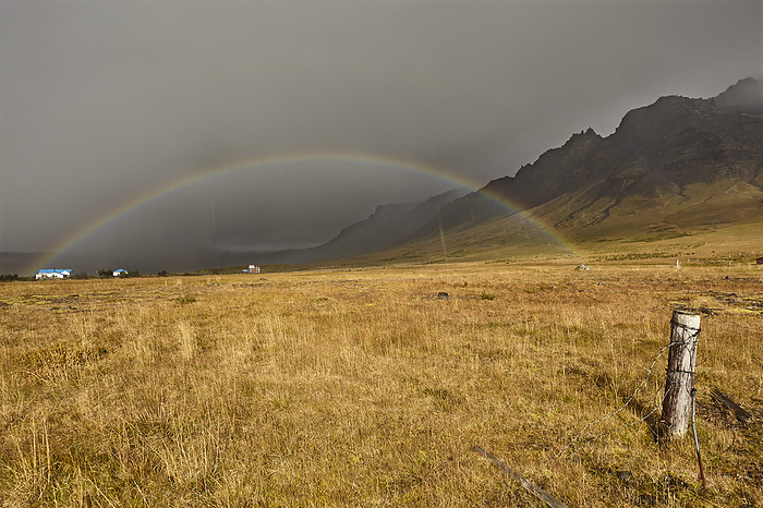 A rainbow arcs across countryside near the town of Stykkisholmur, on the Snaefellsnes peninsula, west coast of Iceland. A rainbow arcs across countryside near the town of Stykkisholmur, Snaefellsnes peninsula, west coast of Iceland, Polar Regions, by Nigel Hicks
