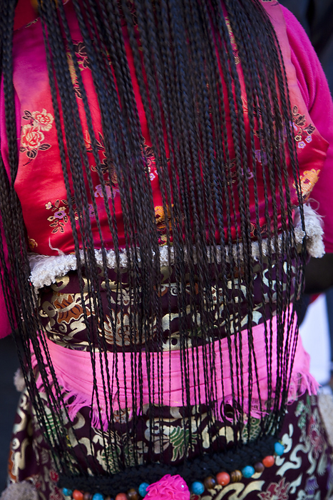 Tibet Back of a Tibetan woman in traditional costume  Lhasa, Tibet, by Michael Melford   Design Pics