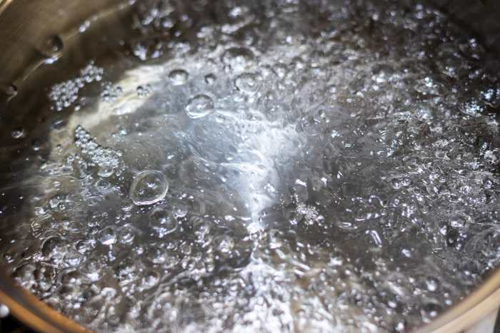 Water boiling in a metal pot