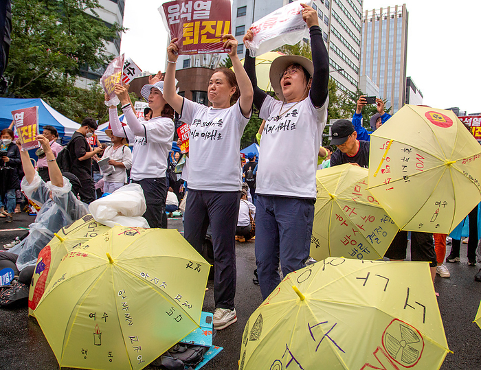 Protest against Japan s plan to release Fukushima nuclear contaminated water into the Pacific Ocean, in Seoul Protest against Japan s plan to release nuclear contaminated water, July 15, 2023 : People participate in a protest to oppose Japan s decision to discharge nuclear contaminated water from the crippled Fukushima nuclear power plant into the Pacific Ocean, in Seoul, South Korera. Protesters condemned South Korean President Yoon Suk Yeol for being a pro Japanese autocrat and called for him to step down. The Korean letters on white T shirts read, Don t kill the ocean of all of us  . Pickets read, Stop discharging nuclear contaminated water   and  Yoon Suk Yeol Resign  .  Photo by Lee Jae Won AFLO   SOUTH KOREA 