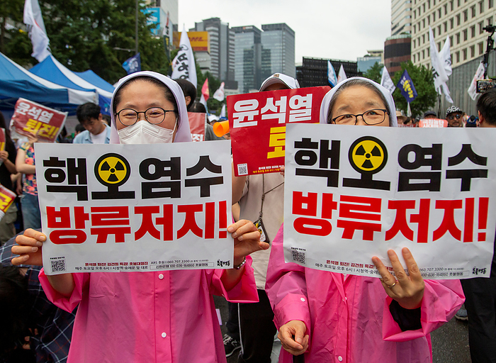 Protest against Japan s plan to release Fukushima nuclear contaminated water into the Pacific Ocean, in Seoul Protest against Japan s plan to release nuclear contaminated water, July 15, 2023 : South Korean Catholic nuns participate in a protest to oppose Japan s decision to discharge nuclear contaminated water from the crippled Fukushima nuclear power plant into the Pacific Ocean, in Seoul, South Korera. Protesters condemned South Korean President Yoon Suk Yeol for being a pro Japanese autocrat and called for him to step down. The Korean letters on pickets read, Stop discharging nuclear contaminated water  .  Photo by Lee Jae Won AFLO   SOUTH KOREA 