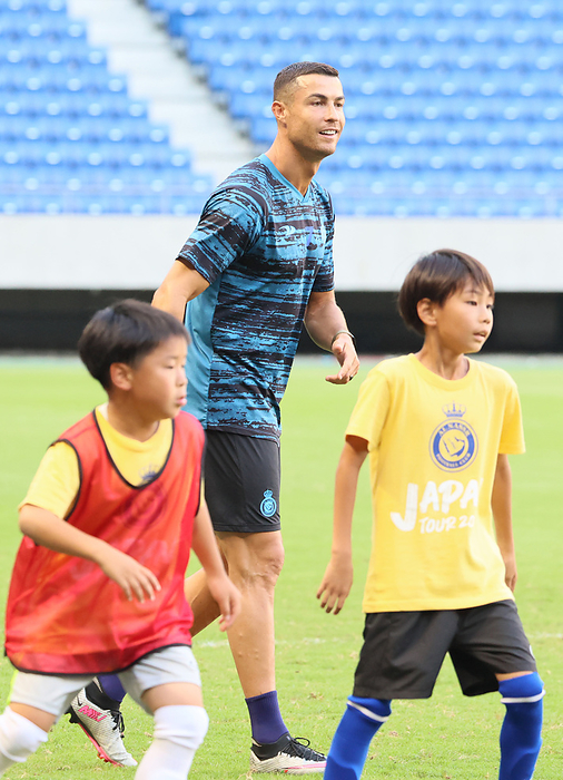 Portuguese football star attends a press conference with his Al Nassr members July 24, 2023, Suita, Japan   Saudi Arabian football team Al Nassr s Portuguese star player Cristiano Ronaldo plays with Japanese school children for a kids football clinic in Suita in Osaka prefecture, western Japan on Monday, July 24, 2023. Al Nassr will have a pre season game against France s Paris Saint Germain.   photo by Yoshio Tsunoda AFLO 