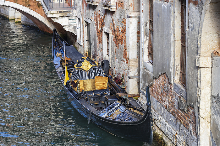 Magnificent gondola in the Rio della Veste with bridge in the San Marco district of Venice in Italy Magnificent gondola in the Rio della Veste with bridge in the San Marco district of Venice in Italy, by Zoonar Dieter Meyer