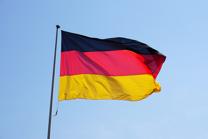 Flag of Germany against clear sky Flag of Germany against clear sky, by Zoonar Axel Bueckert