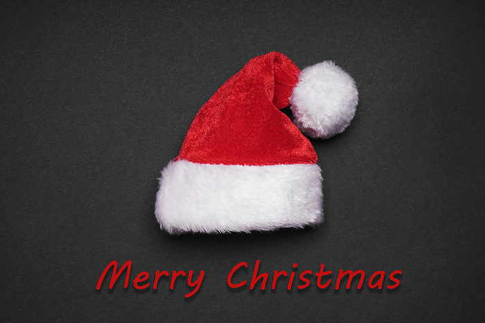 santa claus hat with merry christmas greeting santa claus hat with merry christmas greeting, by Zoonar Axel Bueckert