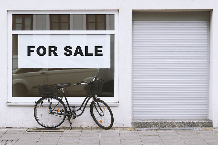for sale sign in store window with bicycle parked outside   shop vacancy for sale sign in store window with bicycle parked outside   shop vacancy, by Zoonar Axel Bueckert