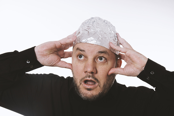 paranoid man wearing tin foil hat paranoid man wearing tin foil hat, by Zoonar Axel Bueckert