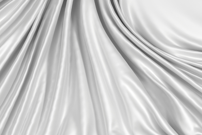 Soft white 3D fabric background with shiny wrinkles.
