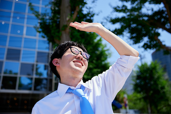 Japanese businessman holding up his hand