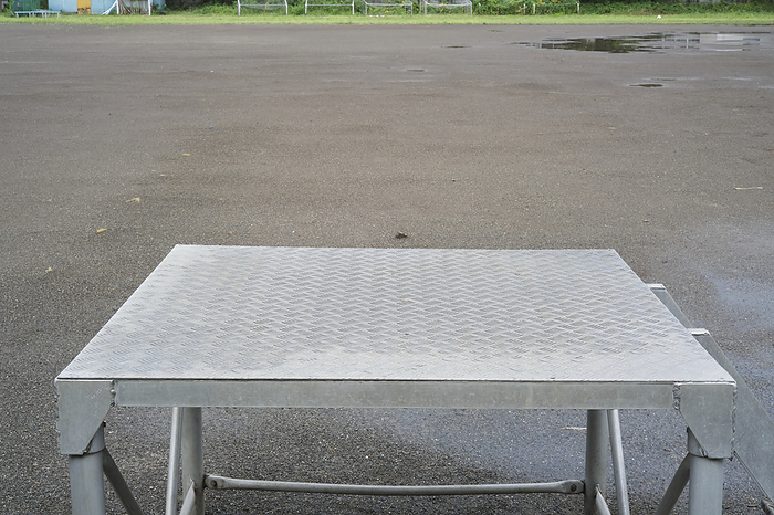 Photographed in 2023 Schoolyard after rain August 2023 Kiyose City, Tokyo Rainwater dries differently at different speeds on the school ground and on the metal morning assembly table.
