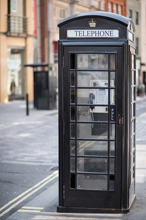black British telephone box in London, United Kingdom. black British telephone box in London, United Kingdom.