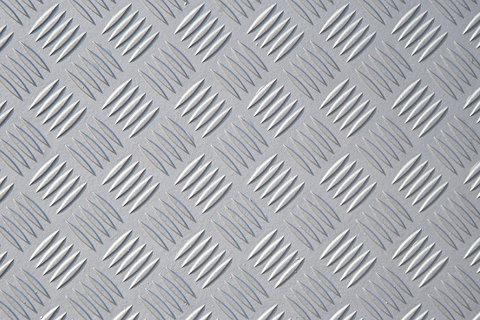 textured surface of a metal checker plate textured surface of a metal checker plate