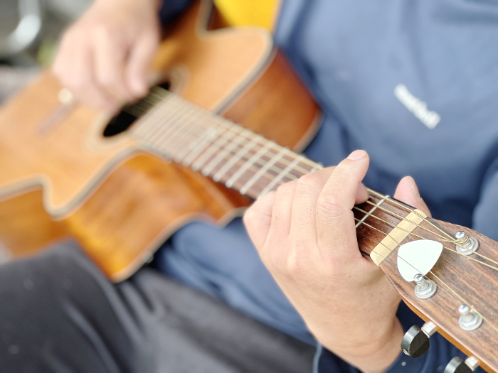 Guitar-playing man's hand