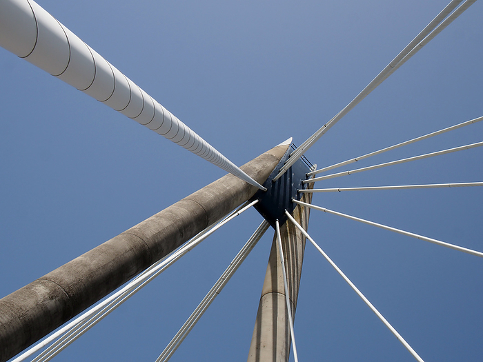 geometric close up of the supports and cables of the suspension bridge in southport merseyside against a blue sky geometric close up of the supports and cables of the suspension bridge in southport merseyside against a blue sky