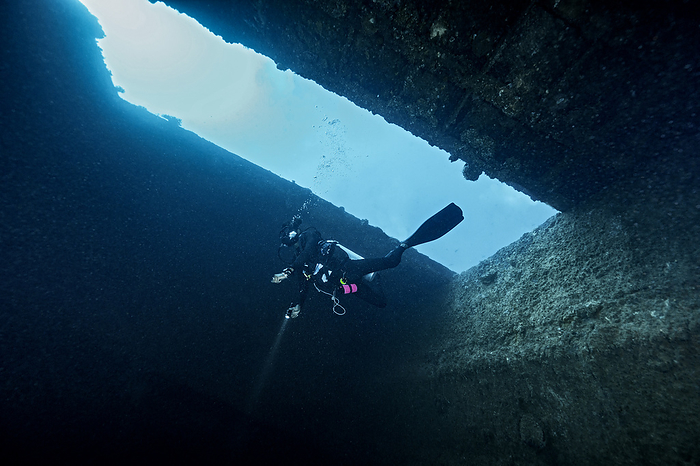 diver exploring shipwreck in the Maldives
