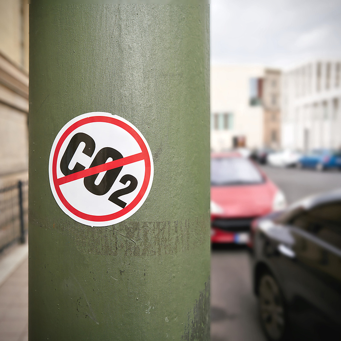 Sticker as a protest against CO2 emissions on a pillar in Berlin Sticker as a protest against CO2 emissions on a pillar in Berlin