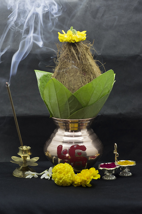 Kalash with flower, tumeric and incense stick Kalash with flower, tumeric and incense stick