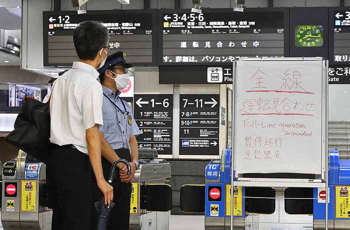 Typhoon Ran, No. 7, crosses through Honshu Passengers are seen contacting station staff at JR Osaka Station after train operations were cancelled due to Typhoon No. 7, in Kita ku, Osaka, Japan, at 8:16 a.m. on August 15, 2023.