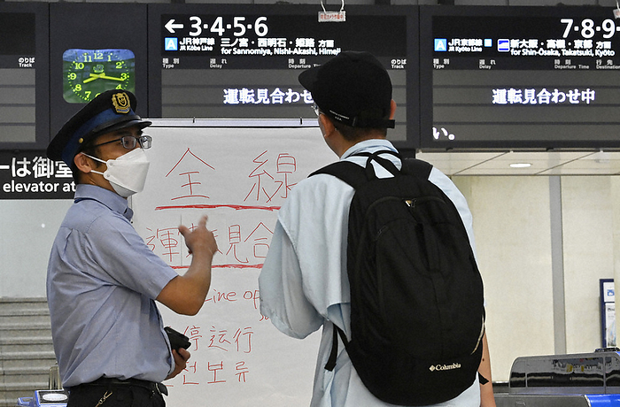Typhoon Ran, No. 7, crosses through Honshu Passengers are seen contacting station staff at JR Osaka Station after train operations were cancelled due to Typhoon No. 7, in Kita ku, Osaka, Japan, at 8:16 a.m. on August 15, 2023.