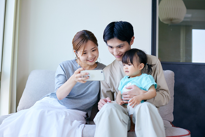 Japanese family looking at a smartphone
