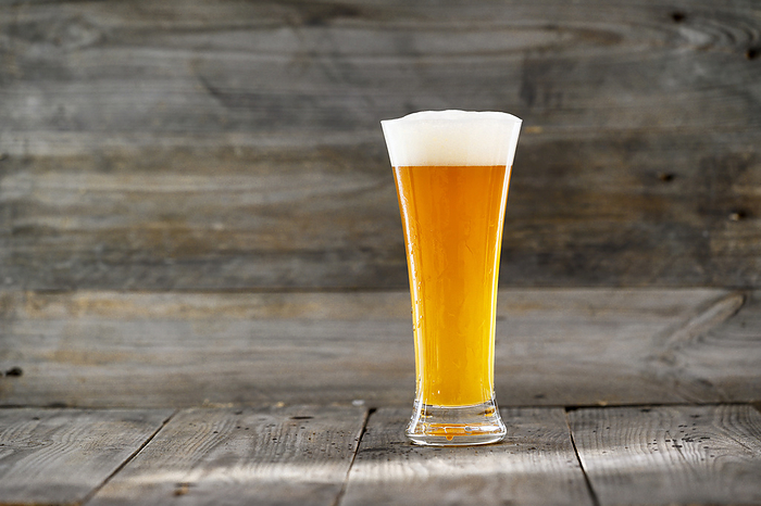 Glass beer on wood background with copyspace. Glass beer on wood background with copyspace.